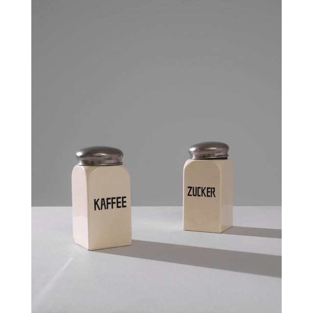 Add a touch of vintage elegance to your kitchen with this exquisite pair of 1900s German ceramic boxes. Each box is...