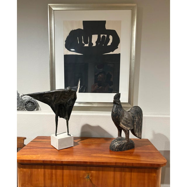 Hand-carved wood rooster sculptures are often found as folk art from Jamaica and are also common in American folk art...