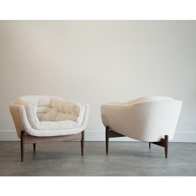 A striking pair of 1950s lounge chairs, fully restored by Stamford Modern to highlight their sculptural elegance and...