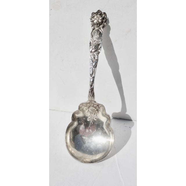 Alvin Bridal Rose serving spoon. 9" long and monogrammed with K on the handle. A reissued piece circa the 1950s. The...
