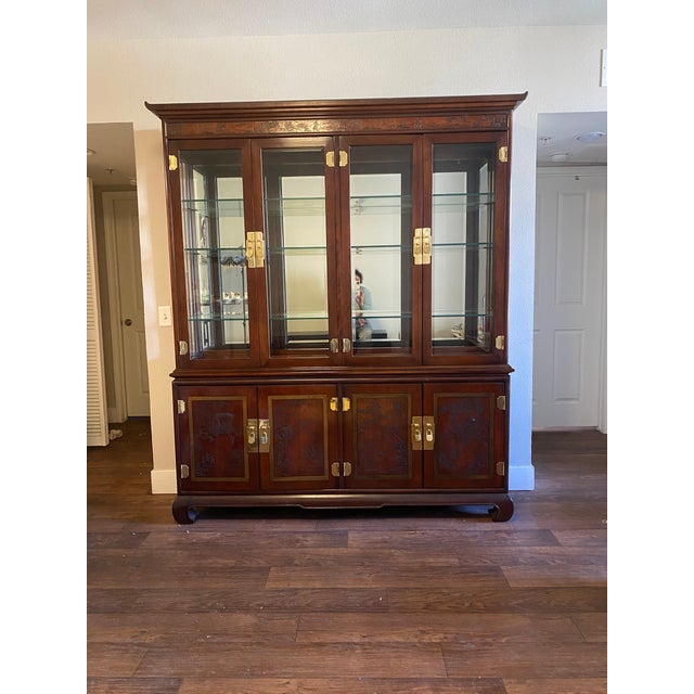 High quality, American made 2 piece china cabinet, lighted anterior, Mirror back, adjustable glass shelves. Lower part of...