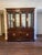 High quality, American made 2 piece china cabinet, lighted anterior, Mirror back, adjustable glass shelves. Lower part of...