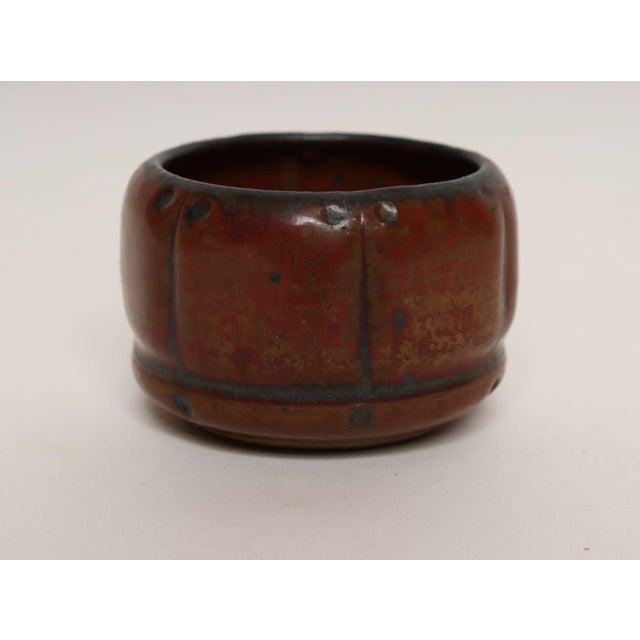 Small stoneware variegated vessel/bud vase with drainage hole by ceramicist, Deanna Nichols (b. 1942-2017, Missouri)....