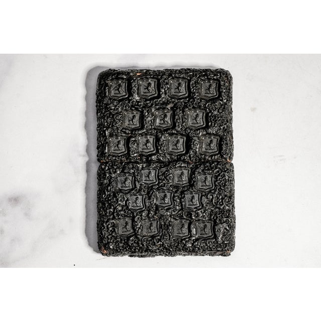 An exceptional and increasingly scarce example of Victorian craftsmanship, this antique gutta-percha calling card case is...