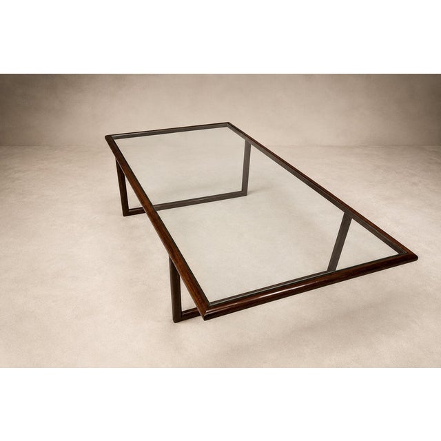 A masterclass in structural refinement and material intelligence, this exceptional coffee table by Joaquim Tenreiro...