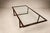 A masterclass in structural refinement and material intelligence, this exceptional coffee table by Joaquim Tenreiro...