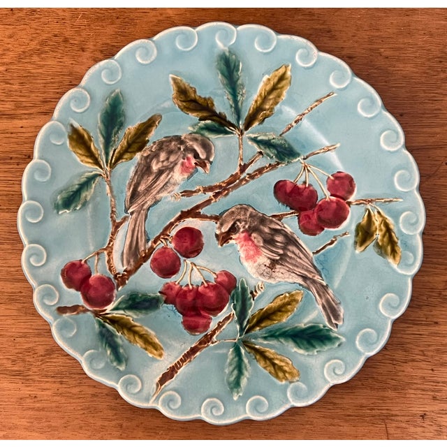 Antique majolica plate made in the late 19th century in France by Sarreguemines. The plate has a scrolling boarder with...