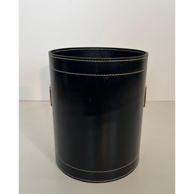 This beautiful and elegant wastepaper basket is made of black leather and brass. It is a French work in the style of...