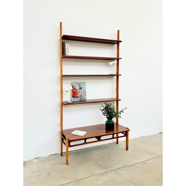 Wall system attributed to william watting, manufactured by scanflex, denmark, 1960s. Teak and beech in a subtle...