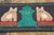 Hand-hooked in wool, this 2x4 contemporary pictorial rug showcases a dark charcoal ground with two striped cat figures...