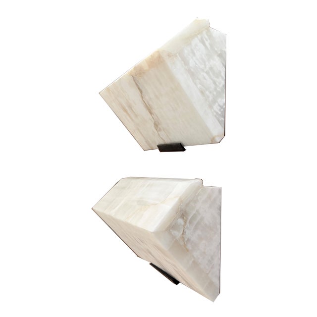 Wall Sconce in the Manner of Pierre CHAREAU, fabricated with Spanish onyx, steel bracket in dark antique bronze finish,...