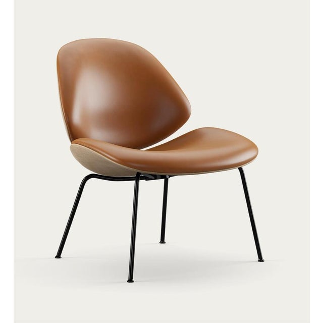 Salto and sigsgaard council family lounge chair legs: black duo upholstery: front: nevada cognac + back: remix 242 for one...