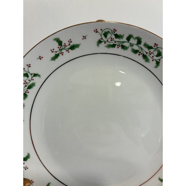 Substantial set of twenty-four Gibson Everyday dessert plates with green holly, red berries, and gold trim. Ideal for...
