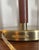 Striking pair of authentic Ralph Lauren Home campaign-style table lamps featuring brushed brass metal shades, brown...