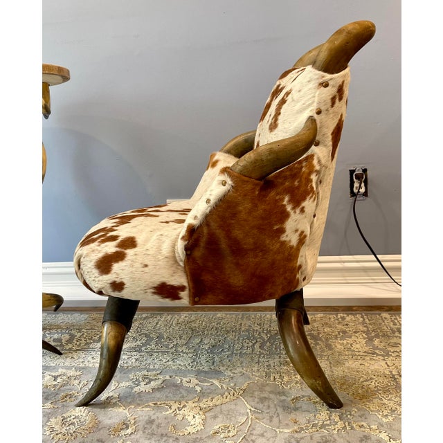 Add a touch of Texas charm with this newly upholstered slipper chair. All original parts except the new cowhide. Chair...