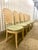 Venetian Grotto-style scalloped shell-back dining chairs, featuring carved wooden shell or fan motifs on the backrests and...