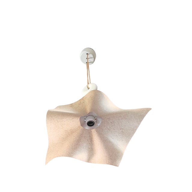 The "Area 50" pendant lamp, designed by Mario Bellini, is a rare and iconic piece produced by Artemide in 1976. The resin...