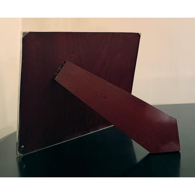 A refined and rare piece from Asprey London, this multi-aperture frame is crafted from solid sterling silver, not plated....