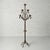 This Belgian iron candelabra, dating from the 1920s–1940s, features a sculptural form, aged patina, and timeless European...