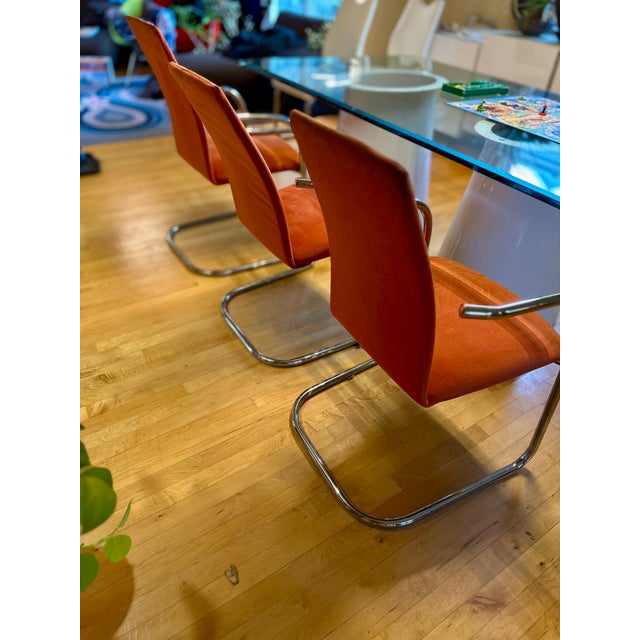Set of three vintage Effezeta cantilever chairs. Crafted in Italy circa the late 1970s, these chairs feature sleek chrome...
