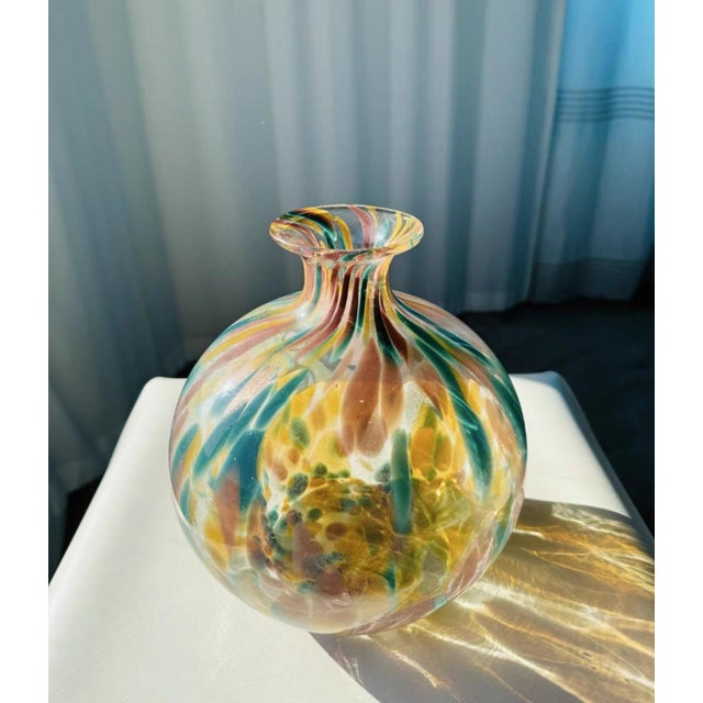 The yellow, green, and pink colors are colorful, and the light shines lightly through the window screen on the bottle,...