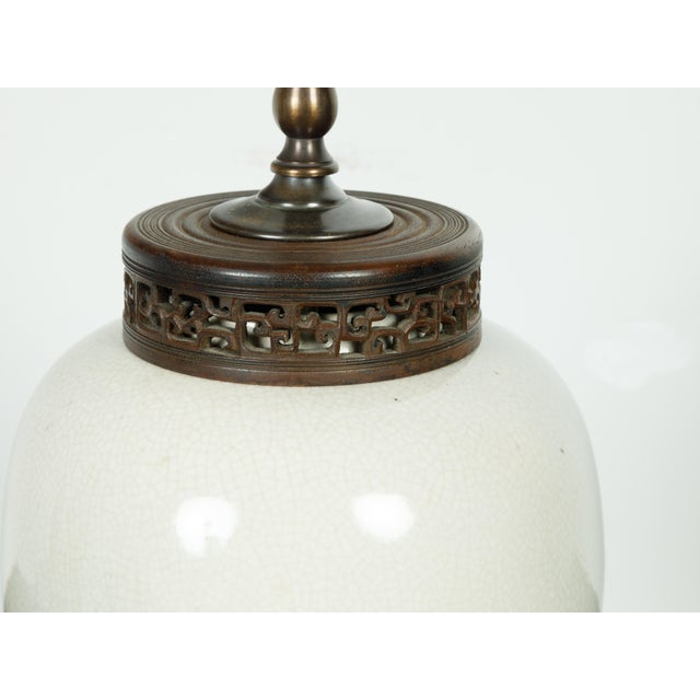 A Japanese vintage table lamp from the mid 20th century, with crackled finish and lucite base. Created in Japan during the...
