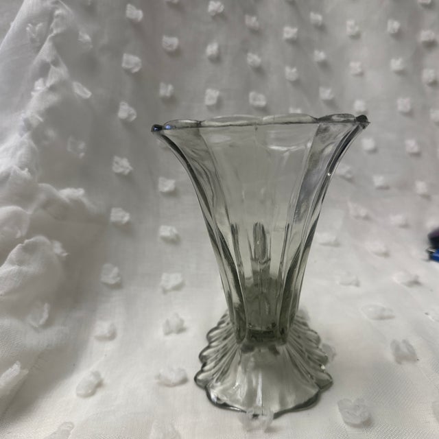 This HEISEY cornucopia vase has the most beautiful beveling to it. The vase is clear with a beautiful green cast in the...