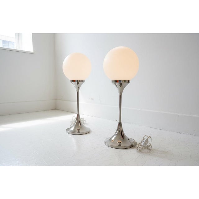 Pair of mid century meets Postmodern chrome and opaline glass lamps. These were created in the 1960s/1970s in Germany by...