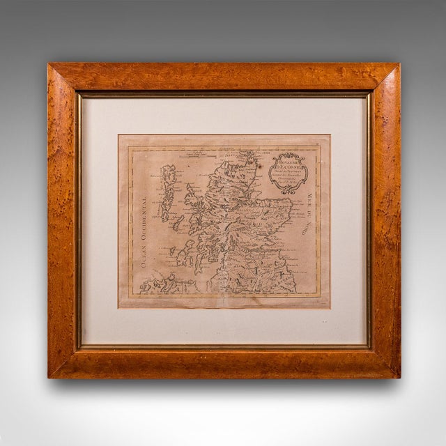 This is an antique map of Scotland. A French, maple framed cartography engraving by Jean-Baptiste Nolin, this posthumous...