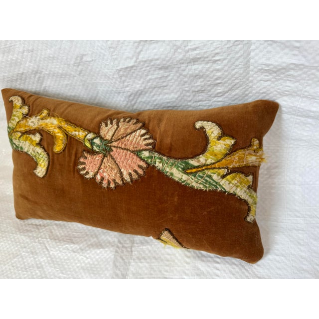 This custom decorative pillow features a rare 17th-century Baroque textile fragment appliquéd onto a rich cinnamon-toned...