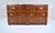 Iconic mid-century modern Campaign style seven-drawer dresser, chest of drawers; 1950s production by Baker Furniture....