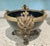 A striking vintage Rococo-style jardinière featuring an elegant dark patinated metal body accented with beautifully...