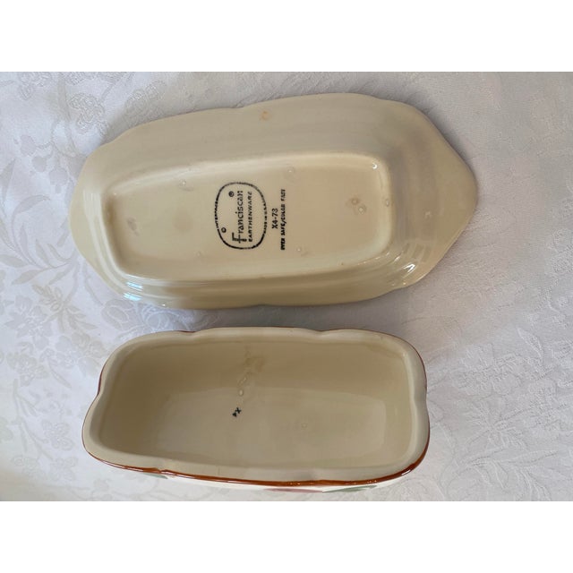 Vintage Franciscan Apple Pattern Butter Dish. The dish measures 7 1/2 inches in length, 3 3/4 inches wide and 3 1/2 inches...