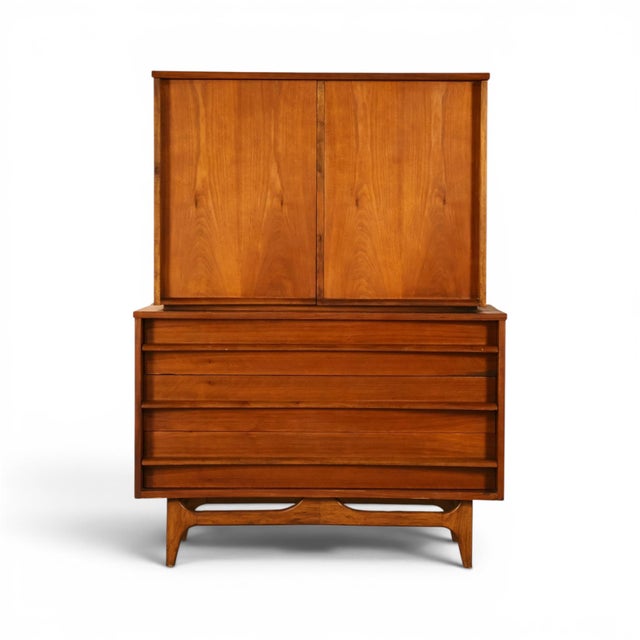 This 1960s Young Manufacturing highboy dresser is a clean, architectural take on the two tier gentlemen's chest, built in...