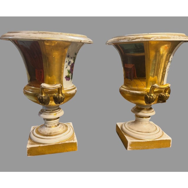 Impressive pair of antique Old Paris / Paris porcelain urn-form cachepots, dating to the 19th century and beautifully...