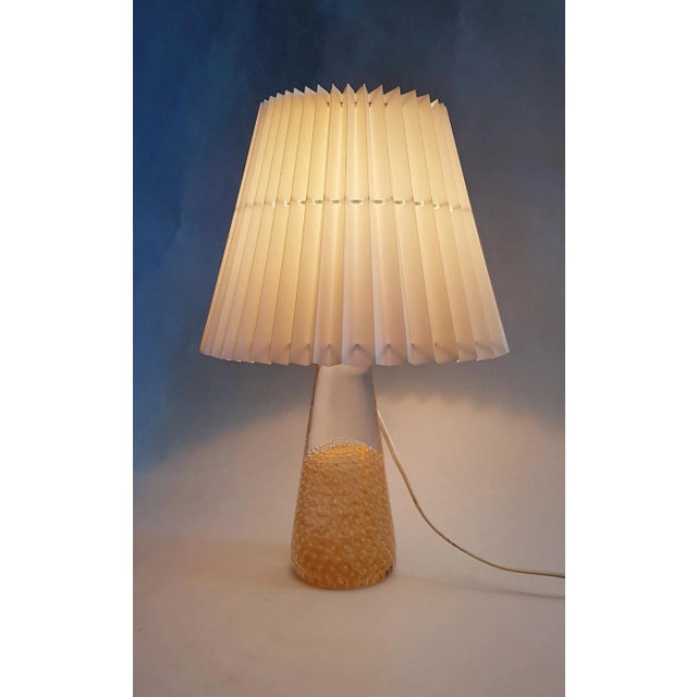 A beautiful and exquisite handmade table lamp in art glass encased with 24-karat gold by Glass House Marcolin Art Crystal,...