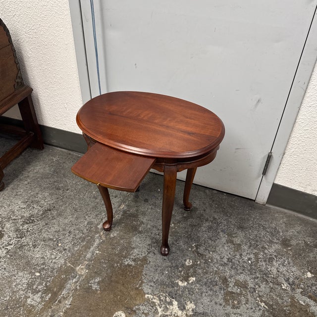 Design Plus Gallery presents a Queen Anne Style Oval Cherry Wood Side Table from Hekman Furniture. This traditional table...