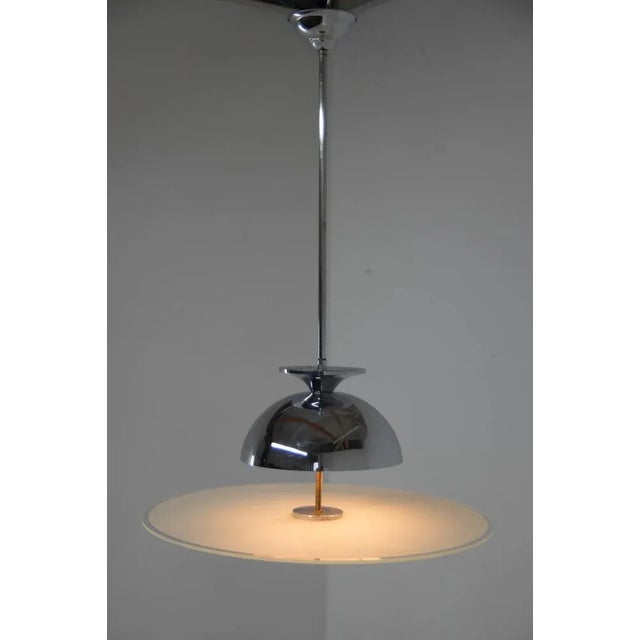 Very elegant Bauhaus/Functionalist chandelier made of chrome and sandblasted glass. Chrome in good condition with minor...