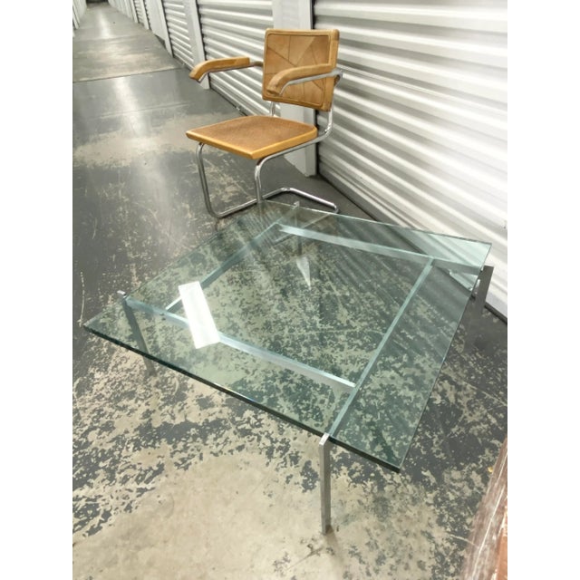 Iconic Poul Kjærholm-attributed PK61 steel + glass cocktail table. Older frame shows patina and age; please refer to...