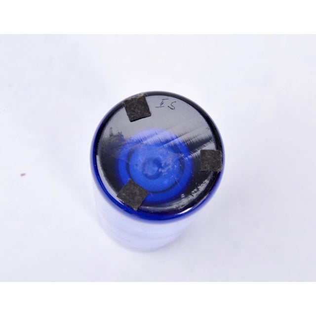 Per Lütken designed the Labrador series in the 1960s. This is one of the smaller vases in the range. Made from blue glass....