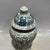 Traditional Chinese blue and white lidded ginger jar decorated with hand-painted interlocking vine and peony floral...