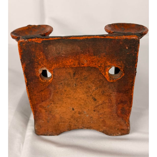 An antique Chinese glazed earthenware incense and lamp wall stand, attributed to the Guangdong region, possibly Dongguan,...