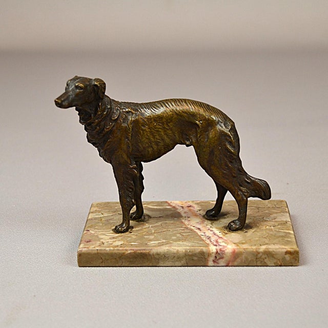 Borzoi dog sculpture. This Art Deco-style figure depicts a Russian wolfhound. The figurine is crafted from patinated...