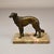 Borzoi dog sculpture. This Art Deco-style figure depicts a Russian wolfhound. The figurine is crafted from patinated...