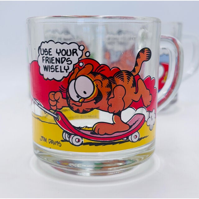 This lot of 1980s McDonald's Garfield & Odie glass mugs features artwork by Jim Davis from 1978. The colorful mugs...