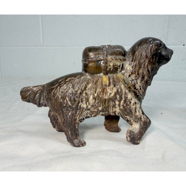 This exquisite antique early 1900's cast Iron saint bernard dog with pack still bank by A.C. Williams is a unique and...
