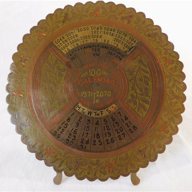 Wonderful vintage mid-century engraved brass 100 year Zodiac calendar. Great piece! Very decorative. Great conversation...