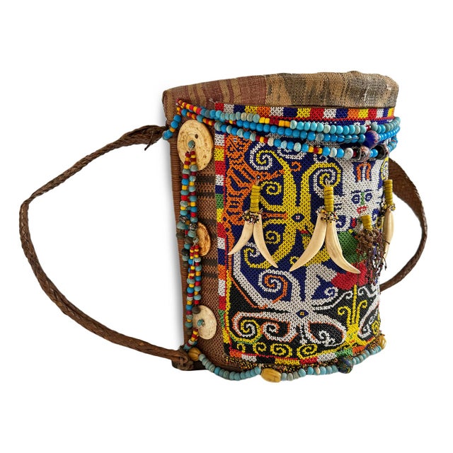 Antique beaded piece from the Kenyah Dayak people of Borneo, Indonesia. Also known as a Kenyah 'ba, this is decorated with...