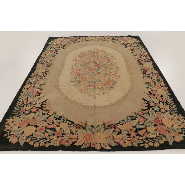 Handmade in wool, circa 1920–1929, this 9x12 antique hooked rug is a distinguished addition to Rug & Kilim’s Antique...