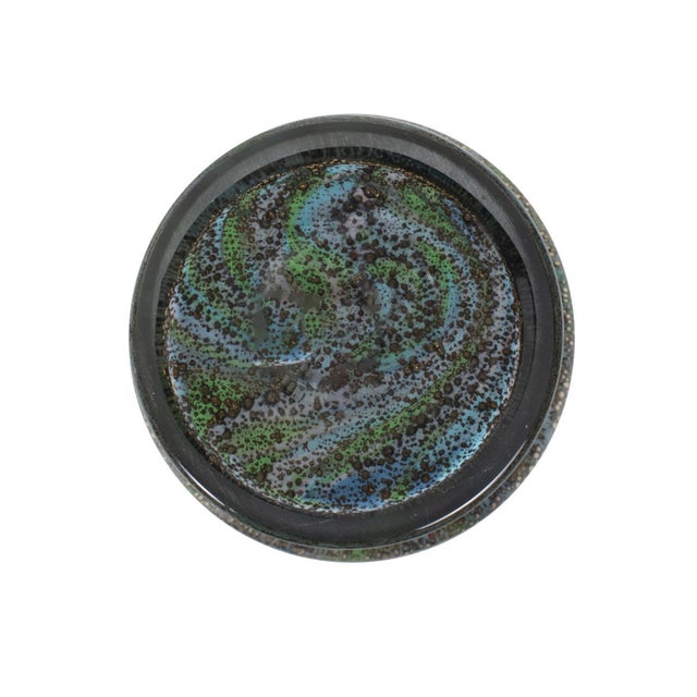 A vibrant addition to your home decor. Crafted to infuse your space with personality, this piece features a kaleidoscope...